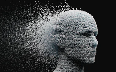 3D dissolving human head made with cube shaped particles.