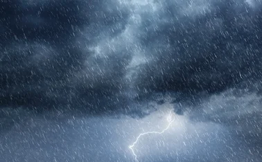 Dark Overcast Sky with Heavy Rain and Lightning - Intense Weather Phenomenon - stock photo