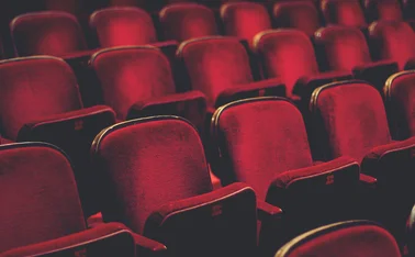 Empty comfortable red seats with numbers in cinema - stock photo
