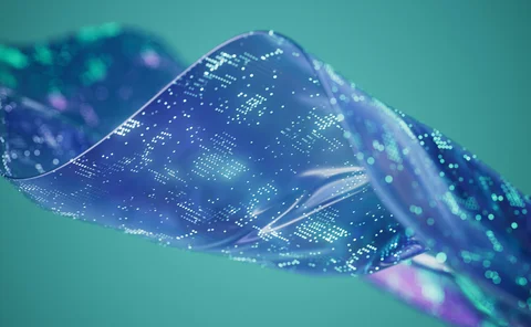 Close-up of a shimmering blue and purple digital fabric or ribbon representing data flow and technology