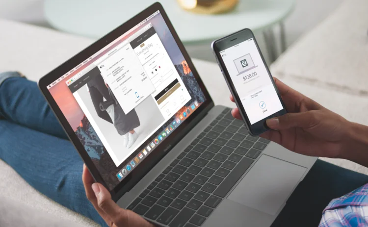 Mac laptop and iphone showing Applepay Mac laptop and iphone showing Applepay