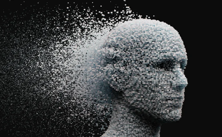 3D dissolving human head made with cube shaped particles.