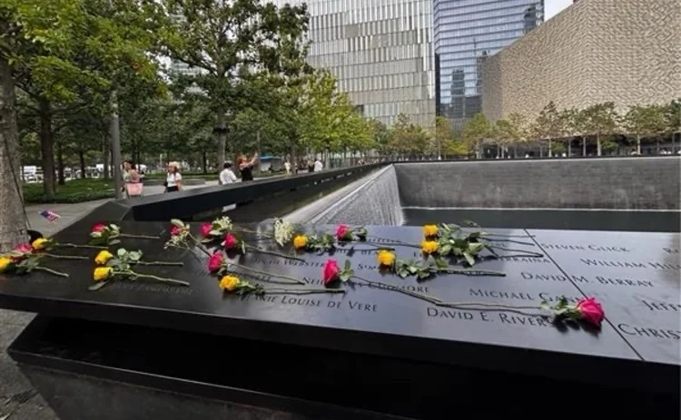 Flowers rest on the Ground Zero site over the names of the RiskWaters Group colleagues