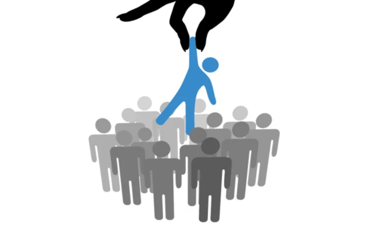 Hand choosing a person from a group of symbol people Hand choosing a person from a group of symbol people
