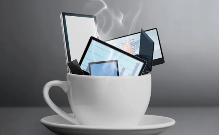 Mobile devices in cup Mobile devices in cup