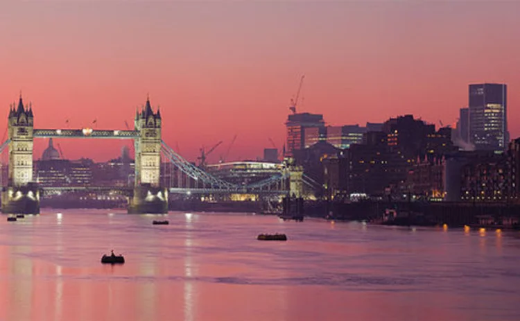 A view of the River Thames and Tower Bridge in London at sunset