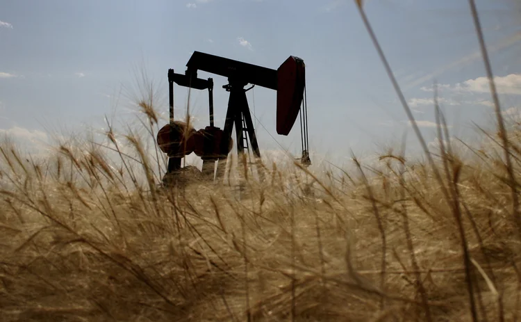 oil-rig-silhouetted-in-wheat-field oil-rig-silhouetted-in-wheat-field