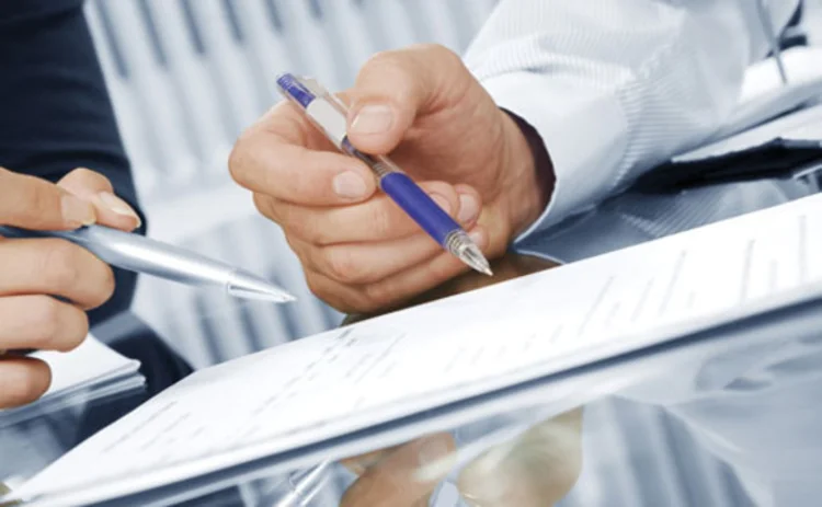 People in a contract negotiation People in a contract negotiation