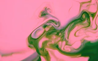 Abstract pink and green liquid Ink paint swirls - stock photo