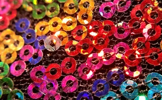 Threaded shiny sequins in all colours of the spectrum stitched together
