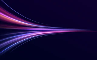 Neon color glowing lines background, high-speed light trails effect. Futuristic dynamic motion technology