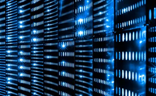 Close-up view of glowing blue LED lights on data server racks in a dark data center, representing cloud computing, cybersecurity, and digital infrastructure