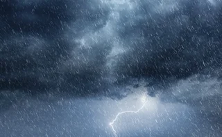 Dark Overcast Sky with Heavy Rain and Lightning - Intense Weather Phenomenon - stock photo