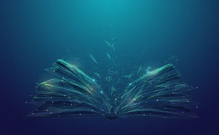 Digital illustration of an open book made of glowing geometric lines and particles, symbolizing knowledge, learning, and futuristic technology