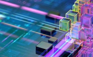 Abstract 3D cubes arranged like a digital CPU or microchip in glowing blue and teal tones with circuit-like depth