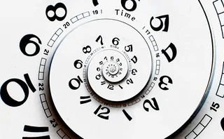 Reversed twisted clock face. Time concept