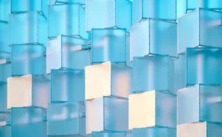 Abstract blue 3D cubes arranged in a layered structure, representing data, networks and digital infrastructure