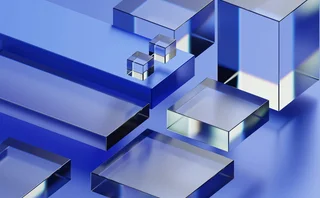 Abstract 3D geometric composition featuring glossy blue and silver metallic cubes and rectangular blocks arranged in a modern minimalist scene, with reflective surfaces, soft lighting, and a futuristic digital aesthetic.