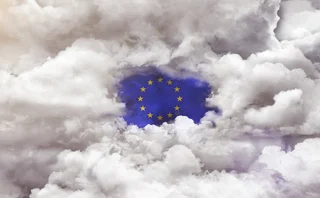 EU flag appearing through a gap in the clouds