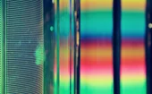 Close-up of a colorful LED display with vibrant pixel patterns and blurred neon light reflections—a visual concept of technology and data