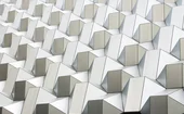 Abstract pattern of interconnected white geometric structures representing data networks, technology and digital infrastructure