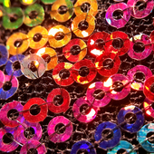 Threaded shiny sequins in all colours of the spectrum stitched together