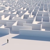 Businessman looking at maze entrance