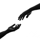 The silhouette of hands reaching out to each other - stock photo