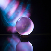 crystal ball lit by blue and pink fiber optics