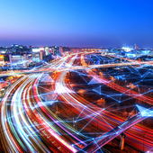 City rush hour time lapse at dusk overlaid by digital nodal grid